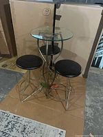 Bar table with two stools full view
