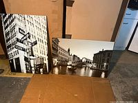 Both glass photo panels standing side by side for size and condition overview