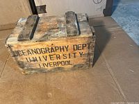 Front view of wooden crate with University of Liverpool Oceanography Dept stencil