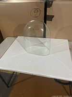 Front view of clear glass dome on table