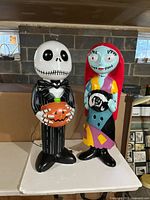 Both Jack Skellington and Sally figures side by side