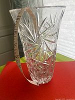 Full view showing vase profile, pinwheel cuts, tape indicating height