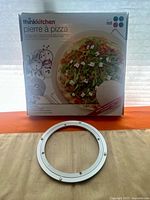 Front of boxed thinkkitchen pizza stone set