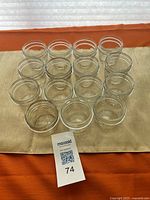 All 15 clear glass jars arranged mouth up