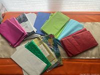 Overview of all tissue paper stacks and packs on table