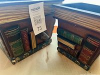 close view of both planters showing book spine details and wear