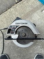 Top view showing Craftsman 218 label, blade and guard