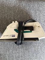 Side view of Black & Decker iron with cord wrapped