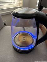 Glass kettle on base with blue LED illumination