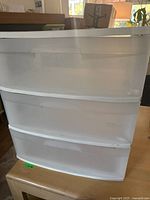 Front view of 3-drawer Sterilite organizer showing white frame and translucent drawers