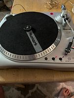 Top view showing entire Numark TTUSB turntable, platter, tonearm, controls