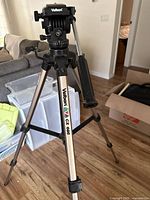 Tripod full view showing legs, head, pan handle