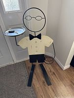 Front view of butler valet stand showing tray and key loop