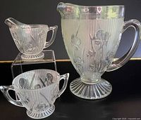 Pitcher, creamer and sugar displayed together