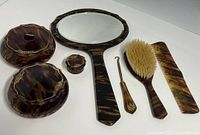 Full view of seven-piece faux tortoiseshell dresser set