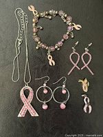 Entire lot displayed: necklace, bracelet, two earring pairs, two pins