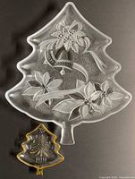 Large and small Christmas tree-shaped glass trays displayed together