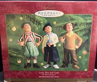 Front of retail box showing the three ornaments