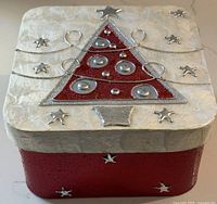 Closed box showing lid design and star accents