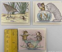 fronts of three illustrated House-Mouse mini cards beside ruler for scale
