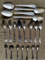 All 19 spoons laid out showing size groups