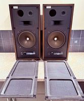Pair of 3A Allegretto speakers with grilles removed showing drivers and grilles in foreground