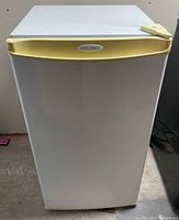 Front view of Diplomat compact fridge showing yellowed handle