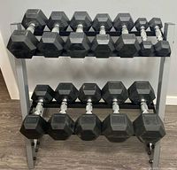 Front view of rack holding 12 hex dumbbells