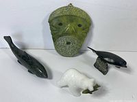 Group shot showing mask, whale, dolphin, bear