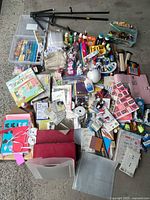 Overall view showing entire assortment of paints, papers, tools and containers spread out