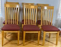 Front view of all six matching slat-back chairs