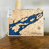 Front view of layered wood and resin map showing entire design and dimensions tag visible