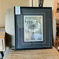 Full view of framed wolf print with double mat and black frame
