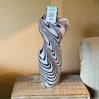 Full view of tall swirl glass vase with MaxSold tag