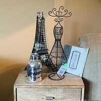 All four Paris themed decorative items displayed on tabletop