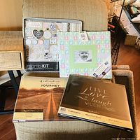 All four new items: two Recollections 12x12 scrapbooks, one Mambi Kit scrapbook album kit, one green patterned 4x6 photo album