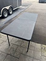 Full view of folded-leg table from side angle