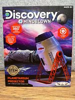 Front of box showing Discovery Mindblown Planetarium Projector and features