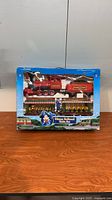Front of sealed Disney Railroad train set box showing locomotive, cars and Mickey graphic