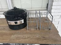 Stock pot and two metal can organizers side by side