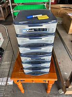 Full view of stacked six-drawer NObreak plastic storage unit on table