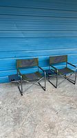 Two folding camping chairs side by side showing overall design