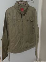 Front view of Celio khaki jacket on hanger