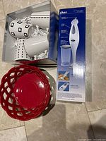 Boxed mugs, red temp-tations bowl, Oster blender box
