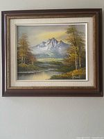 Full view of framed oil painting on wall