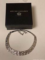 Silver Gallery branded box with sterling silver collar necklace displayed