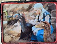 Reverse side depicting Daenerys with three dragons on rocks