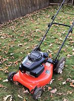Front left view of Ariens mower showing deck, engine and wheels