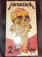 Front view of Metallica "2 of One" VHS slipcase showing artwork and title