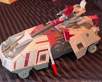 Left front three-quarter view of AT-TE body showing paint, cannon, missing legs, scale pen